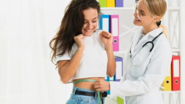 medium shot happy doctor measuring girl 23 2148302100 12