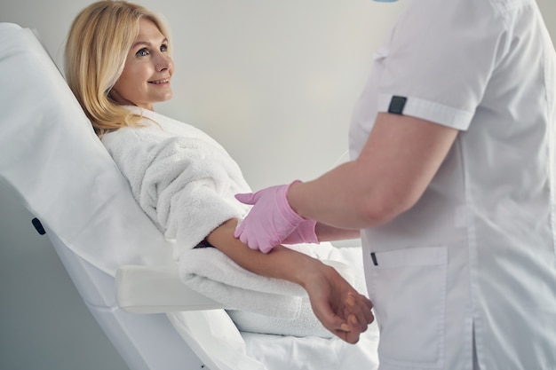 lovely mature female getting vitamin therapy with help intravenous cannulation 447912 3241