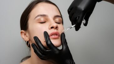 high angle woman getting lip fillers 23 2149341863